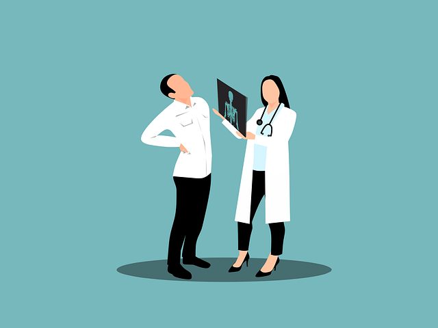 A doctor in Los Angeles shows a patient an X-ray image while the patient holds their lower back in pain. Both are standing against a plain blue background.