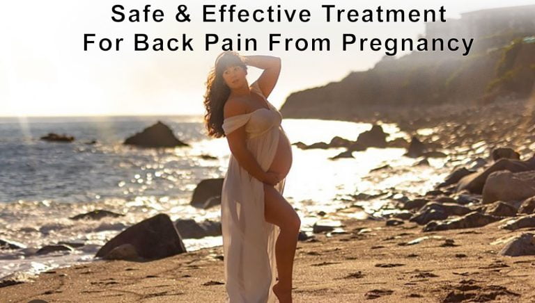Pregnant woman in a flowing white dress stands on a rocky Los Angeles beach at sunset, holding her belly. Text above reads: Safe & Effective Treatment For Back Pain From Pregnancy.